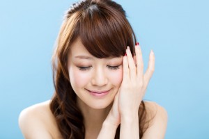 Beautiful asian woman on blue background