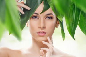 beautiful girl and green leaves