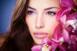 brunette woman beauty portrait with orchid